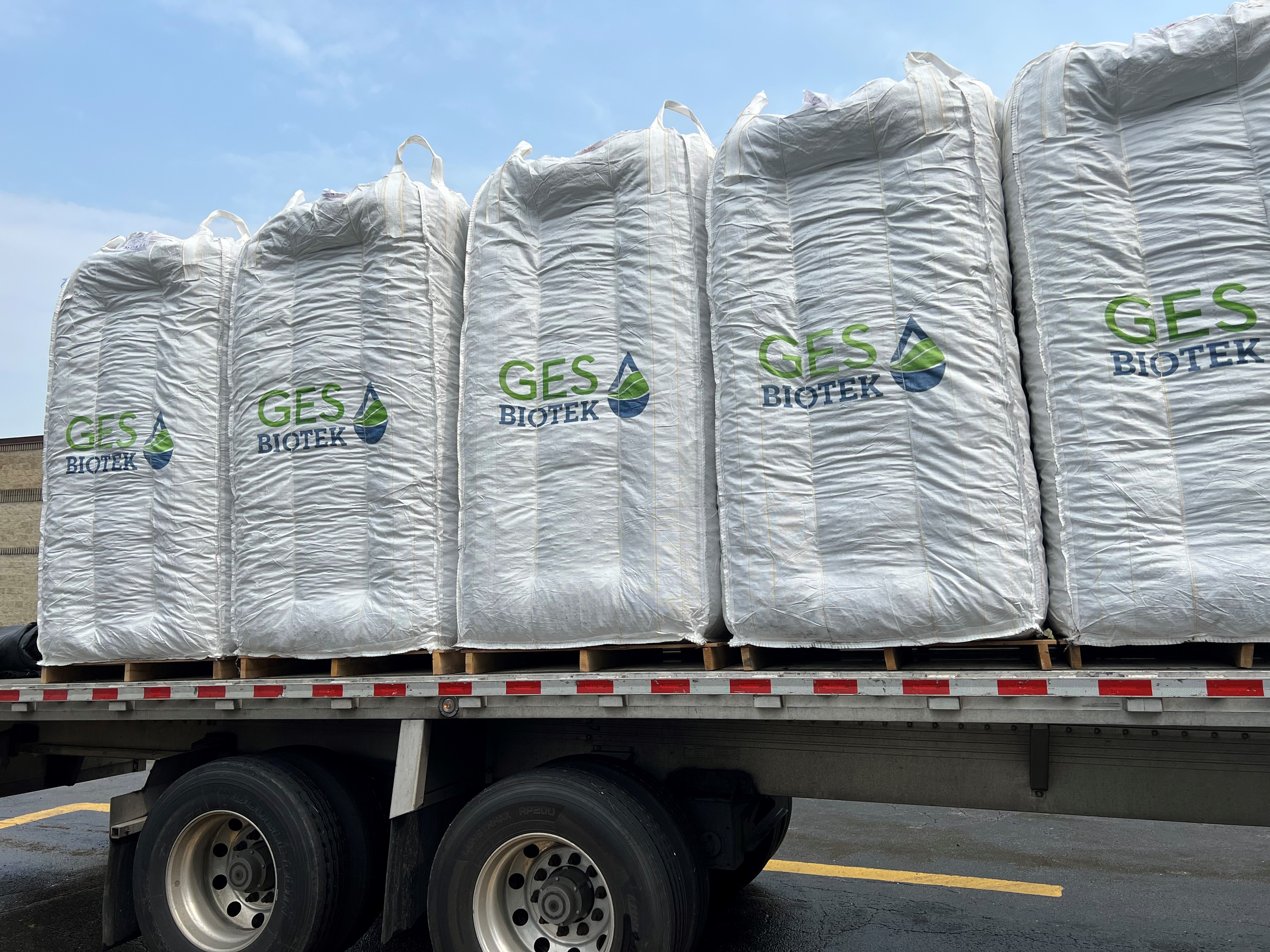 Super Sacks filled with Enhanced Cell-Max PLUS on a flatbed truck