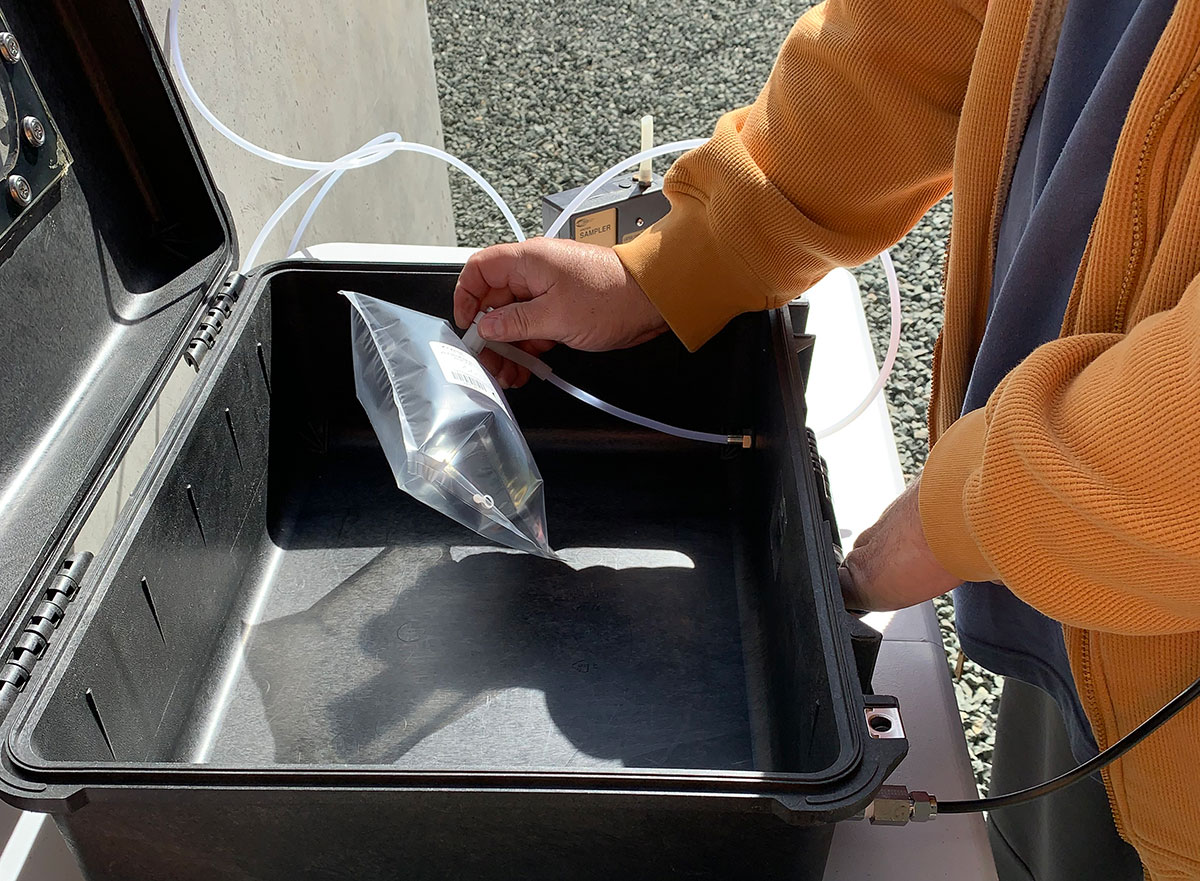 Male hands holding an air sample bag