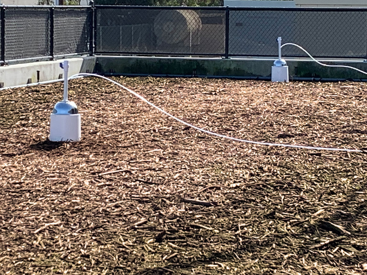 Two flux chambers rest atop the Fiber-Max media gathering air samples